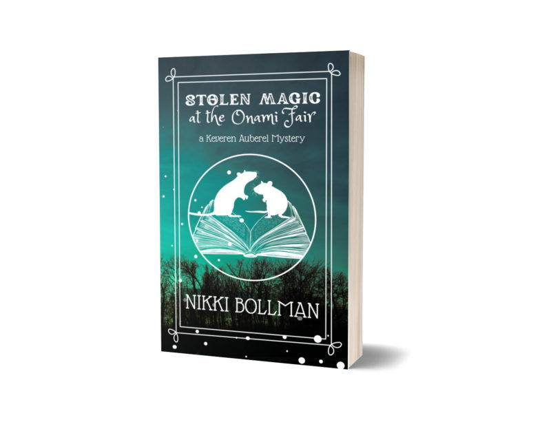 3D mockup of paperback of my book Stolen Magic at the Onami Fair. Cover features silhouettes of two rats standing above an open book against a teal sunset picture of a forest.